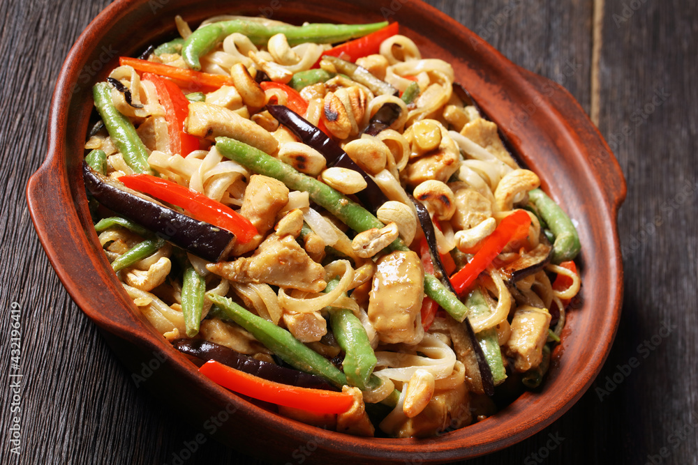 chicken satay rice noodle with veggies, top view