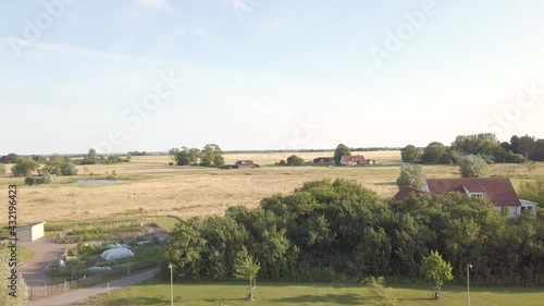 Pan over farm fields during summer in Skåne, Sweden