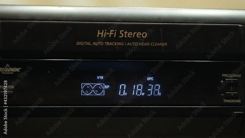 Close-up look of VHS player's display which shows that inserted tape is rewind 10 minutes forward Close-up look of VHS player's display which shows that inserted tape is rewind 10 minutes forward