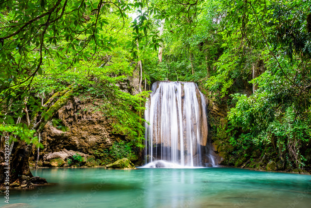 Waterfall and blue emerald water color in Erawan national park. Erawan Waterfall, Beautiful nature rock waterfall steps in tropical rainforest at Kanchanaburi province, Thailand Waterfall and blue emerald water color in Erawan national park. Erawan Waterfall, Beautiful nature rock waterfall steps in tropical rainforest at Kanchanaburi province, Thailand
