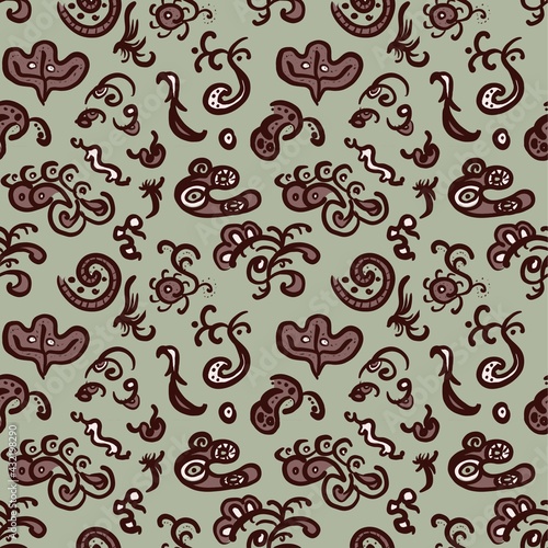 Doodle seamless pattern. Unusual forms. Brown graphic arts with white spots on green background. Hand drawn