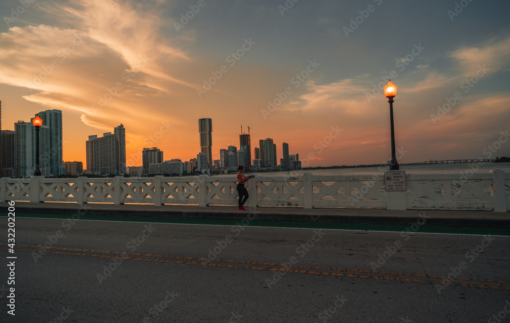 sunset in the city bridge woman 