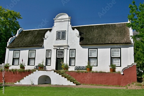 
Historic building on the Rustenberg Estate. Most of the buildings are in the traditional Cape Dutch style, with beautiful gables and homely thatch roofs. Republic of South  Africa.
 photo