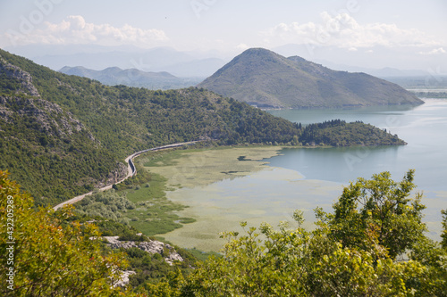 Landscape with mountains and lake on a summer day, Skadar lake, Montenegro.