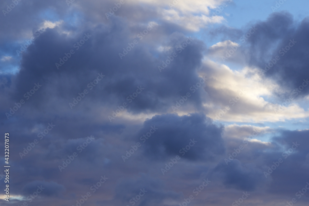 Background of blue cumulus clouds at twilight