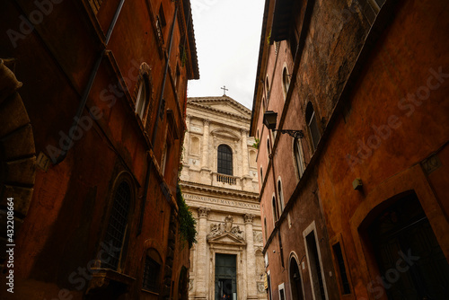 Detail of the facade of the Basilica of San Giovanni dei Fiorentini at the end of a narrow street in central Rome  Italy