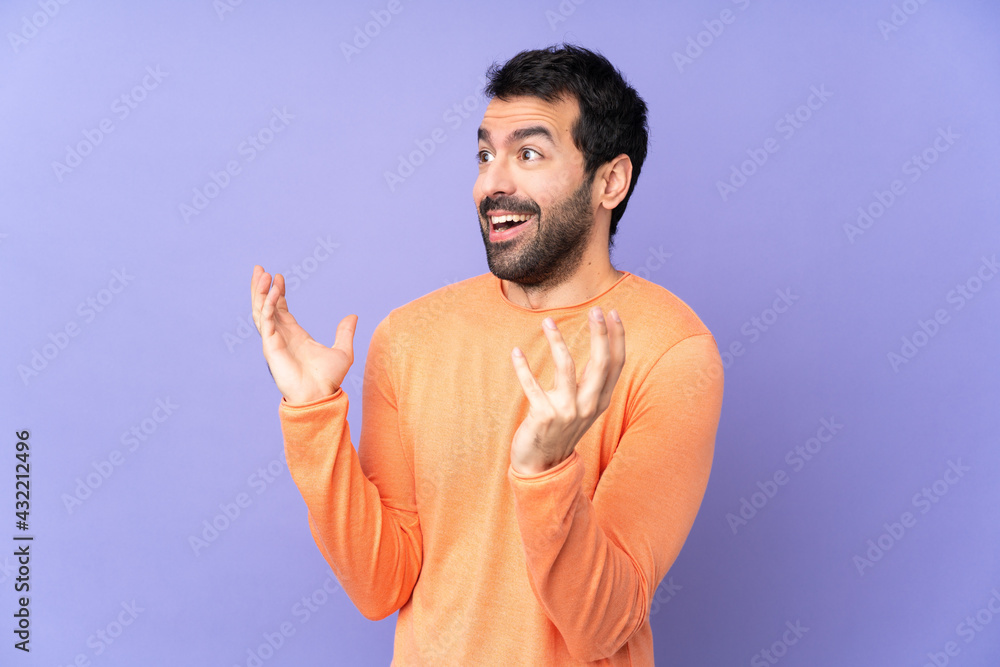 Caucasian handsome man over isolated purple background with surprise facial expression Caucasian handsome man over isolated purple background with surprise facial expression