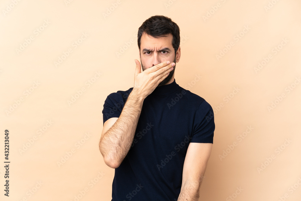 Caucasian handsome man over isolated background covering mouth with hands Caucasian handsome man over isolated background covering mouth with hands