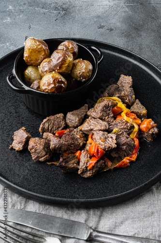 Beef stew goulash - rustic style, on gray stone background
