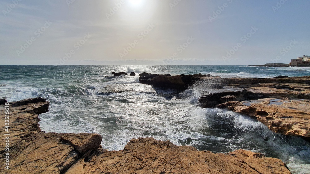 Waves crashing on rocks. Salt production. Discover the world. Heavy wind at the beach. Place to relax and enjoy tanning. Vacations in Lebanon. Amazing view Waves crashing on rocks. Salt production. Discover the world. Heavy wind at the beach. Place to relax and enjoy tanning. Vacations in Lebanon. Amazing view