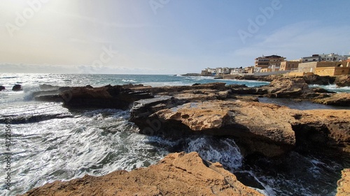 Waves crashing on rocks. Salt production. Discover the world. Heavy wind at the beach. Place to relax and enjoy tanning. Vacations in Lebanon. Sea Sunset