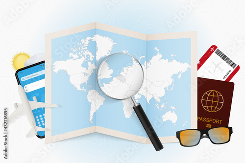 Travel destination Belgium, tourism mockup with travel equipment and world map with magnifying glass on a Belgium.
