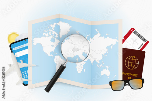 Travel destination Switzerland, tourism mockup with travel equipment and world map with magnifying glass on a Switzerland.