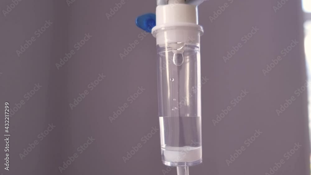 Close up of IV drip Saline dropper dropper with dripping medicine. Drug