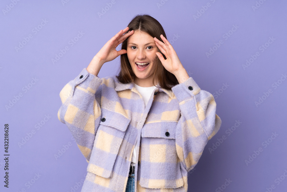 Teenager caucasian girl isolated on purple background with surprise expression Teenager caucasian girl isolated on purple background with surprise expression