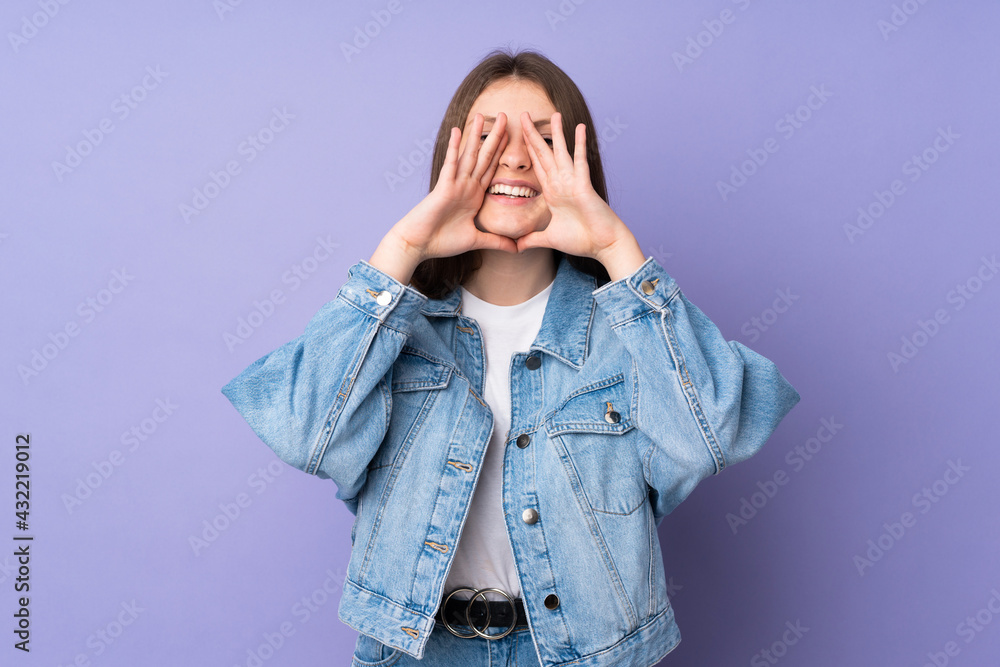 Teenager caucasian girl isolated on purple background shouting and announcing something Teenager caucasian girl isolated on purple background shouting and announcing something