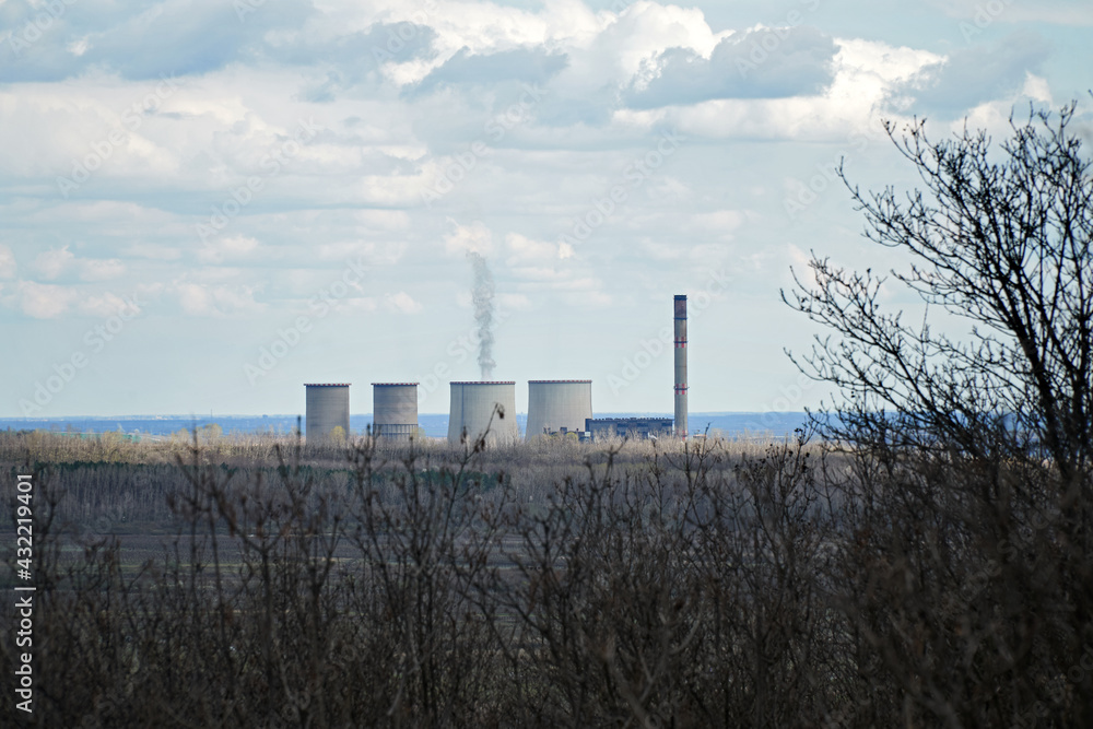 Smoking power plant in Visonta, Hungary. Color photo illustration of environmental pollution, energy industry or greenhouse gas emission.