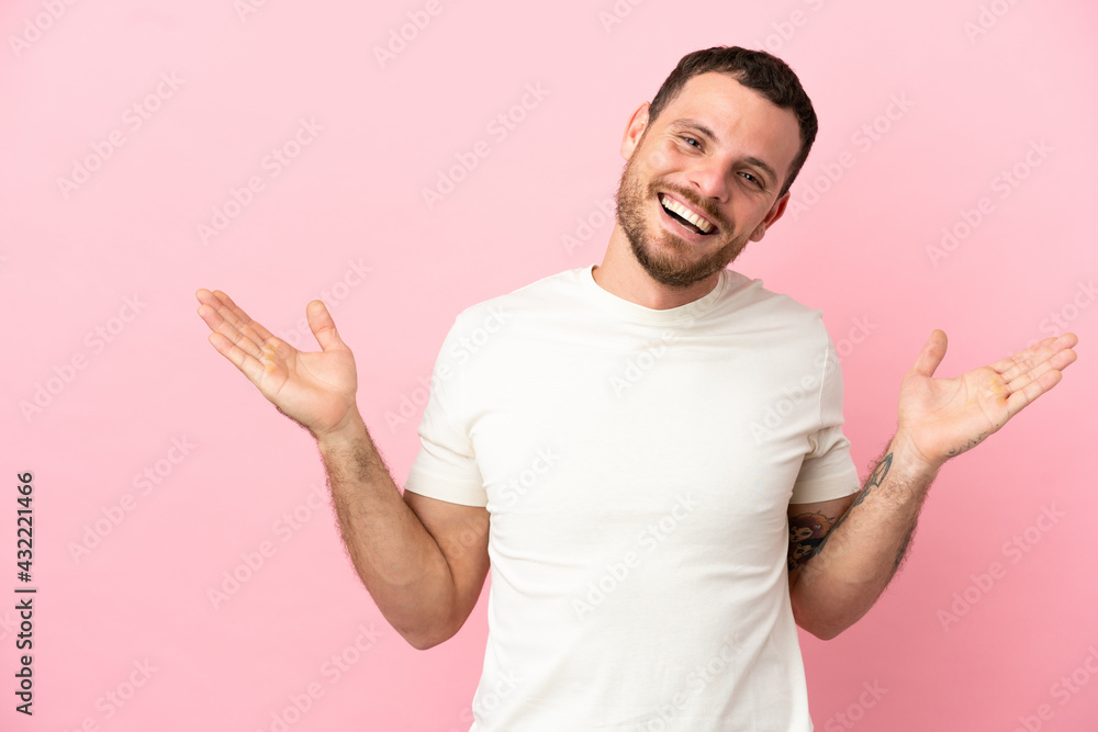 Young Brazilian man isolated on pink background with shocked facial expression Young Brazilian man isolated on pink background with shocked facial expression