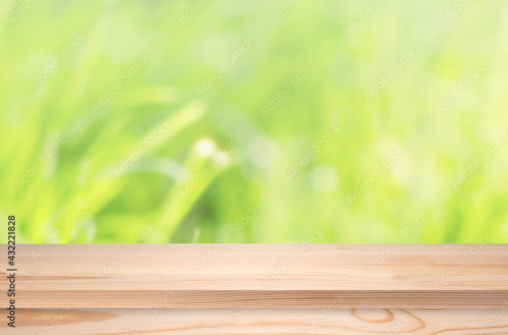 Wooden table or tabletop, empty shelf in front of defocused nature landscape. Pine table as template Wooden table or tabletop, empty shelf in front of defocused nature landscape. Pine table as template
