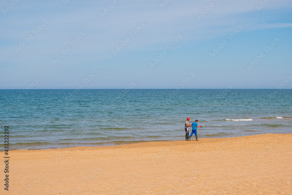 parent and child on beach