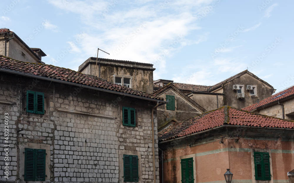 Windows, roofs, sky. Old Kotor, Montenego