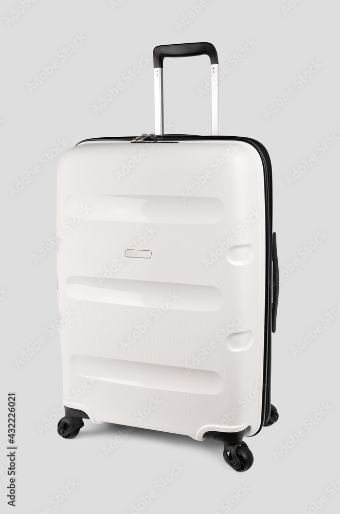 Plastic travel suitcase. White suitcase isolated on white background. Polycarbonate suitcase isolated on white. White suitcase. Plastic travel suitcase. White suitcase isolated on white background. Polycarbonate suitcase isolated on white. White suitcase.
