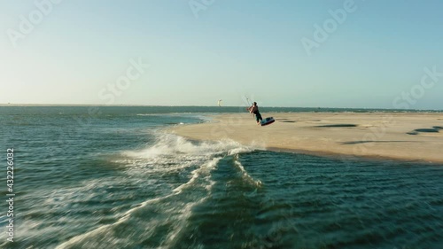 kitesurfer jumping over beach aerial drone following water sports travel tourism summer brazil atins 4k