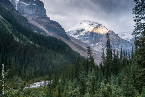 Lefroy Peak in Canadian Rockies lit by a sunlight on otherwise cloudy day. Mt.Lefroy viewed from the Plain of Six Glaciers trail, Banff National Park, Canada. Hiking Canadian Rockies.