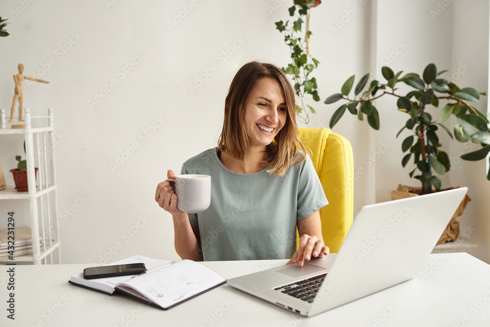 woman working on computer at home woman working on computer at home