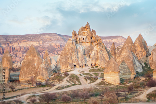 Amazing Cappadocia landscape with and caves in mountains. Adventure in Turkey tourist destination Cappadocia red valley