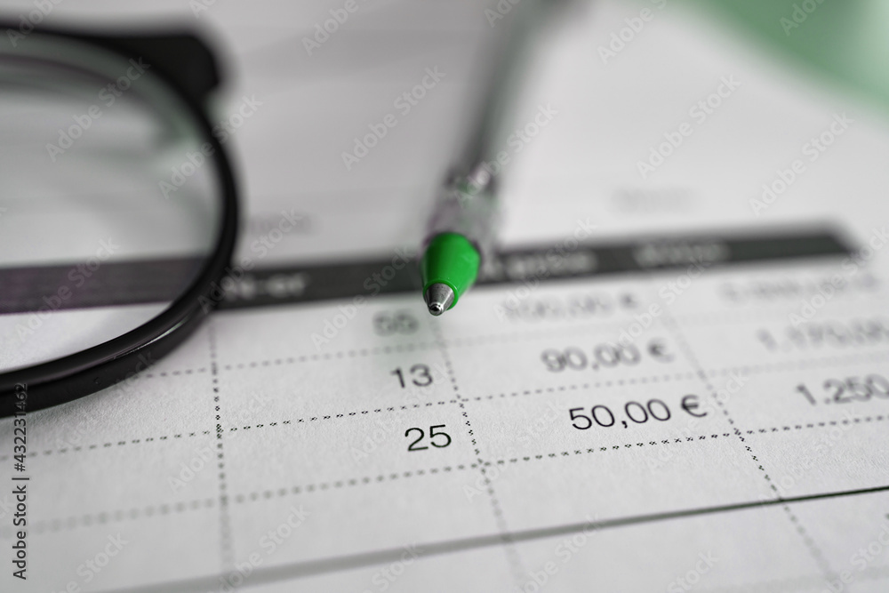 Invoice with a ballpen on the tabel, close up Invoice with a ballpen on the tabel, close up
