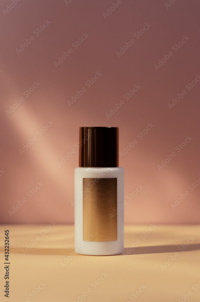 white cream tube with gold cap isolated on pink blurred background, cosmetics mock up, skin care, body lotion - obrazy, fototapety, plakaty 