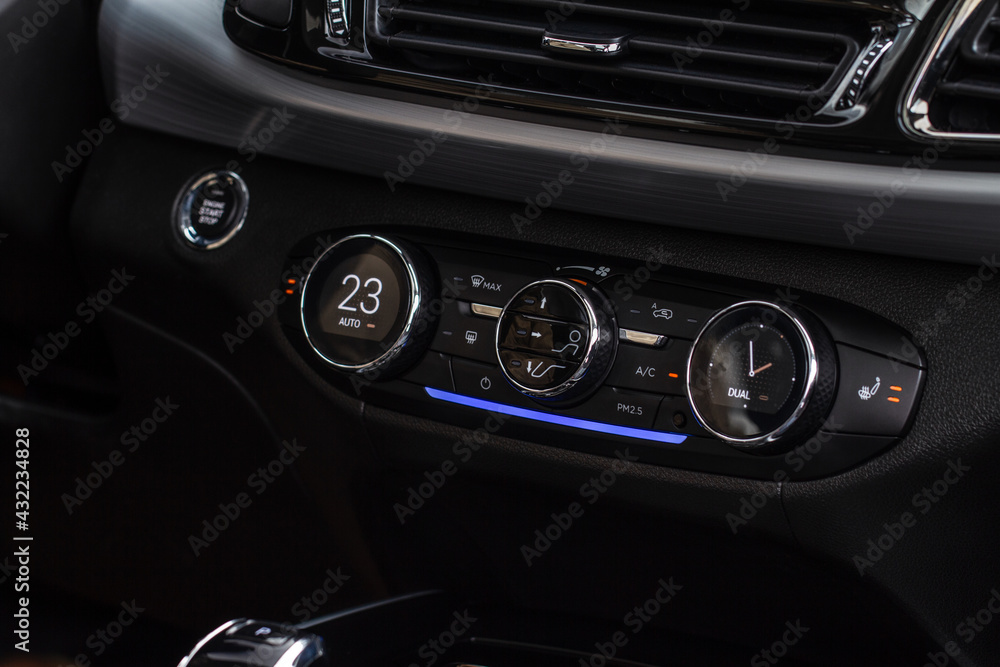 Digital control panel car air conditioner dashboard. Modern car interior conditioning buttons inside a car close up view. Digital control panel car air conditioner dashboard. Modern car interior conditioning buttons inside a car close up view.