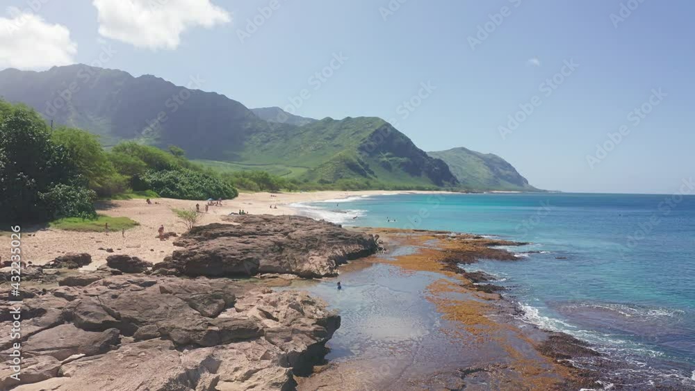Aerial view from above down Drone shot. Beautiful tropical beach sea with white sand. Top view. Empty and clean beach in summer season on Oahu Hawaii Island. Aerial view from above down Drone shot. Beautiful tropical beach sea with white sand. Top view. Empty and clean beach in summer season on Oahu Hawaii Island.
