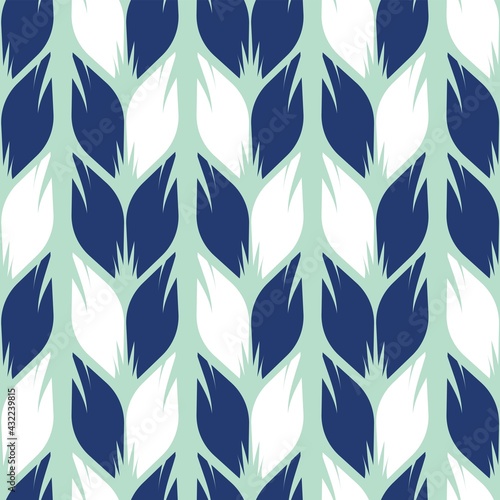 Seamless pattern of white and dark blue leaves on a light background