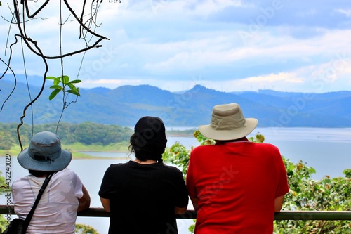 Mother, Father and daughter at view point on vacation Arenal lake Costa Rica  Quarantine end photo