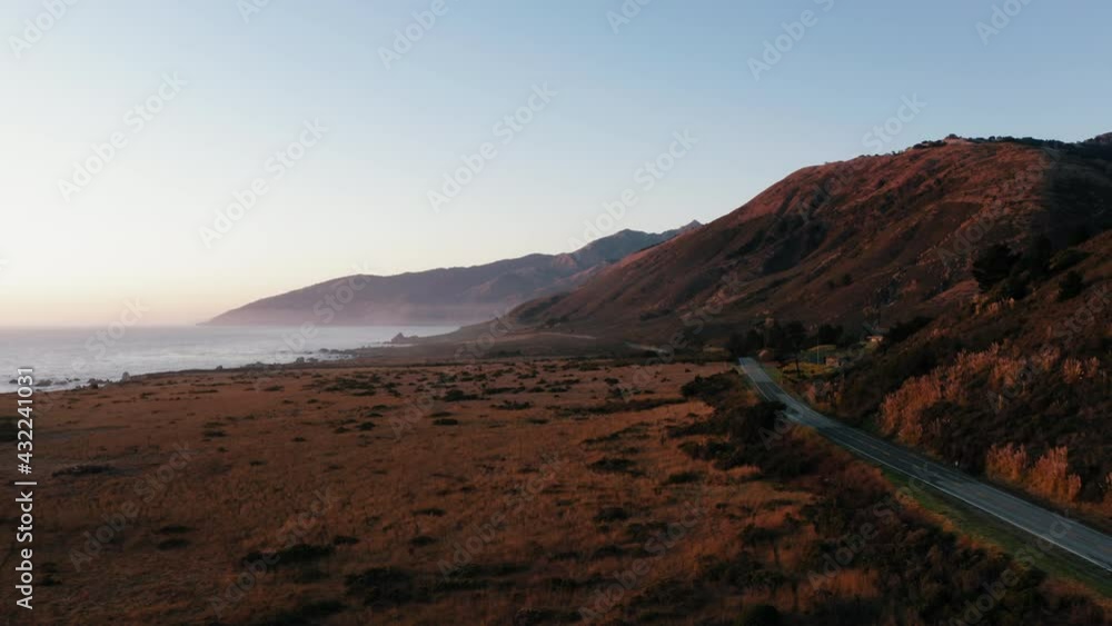 highway one at sunset california usa west coast coast line aerial drone panorama mountains 4k highway one at sunset california usa west coast coast line aerial drone panorama mountains 4k