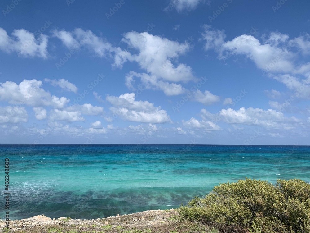 beach with blue sky and clouds