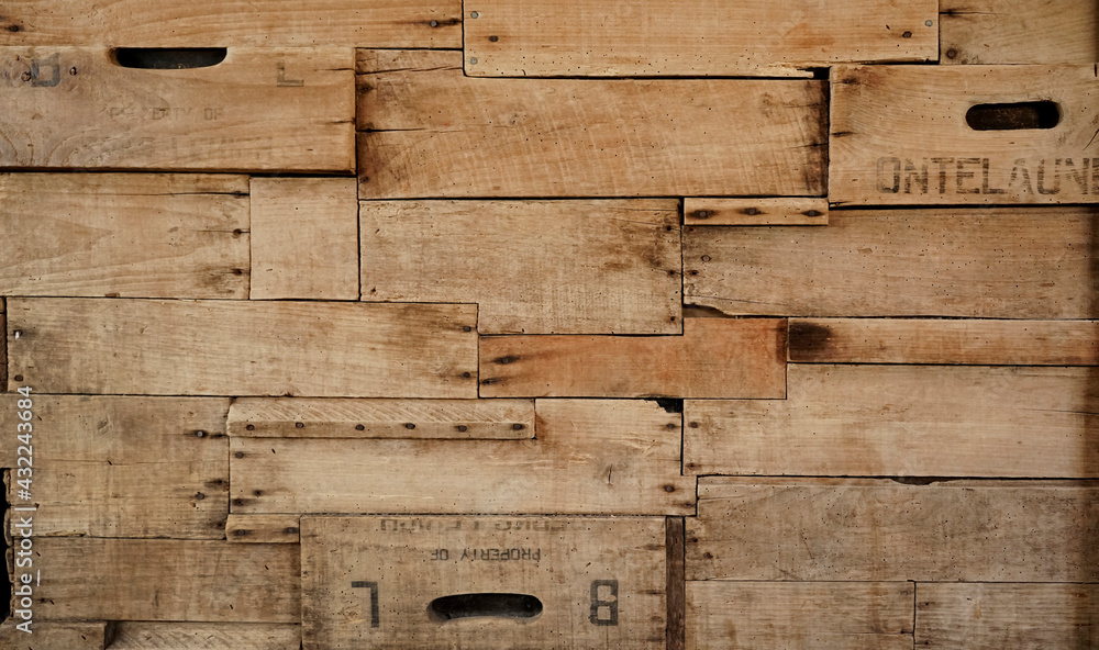 Wood background made of old wine crates in a wine cellar with aged