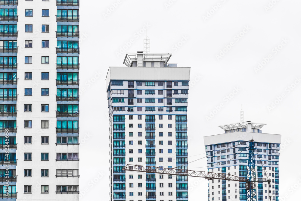 New modern high-rise apartment urban building exterior, facade of a residential city house New modern high-rise apartment urban building exterior, facade of a residential city house
