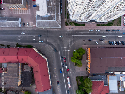 T shaped intersection in the city with tall buildings and cars