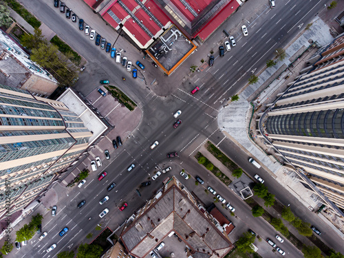 Diagonal intersection with cars in busy city life
