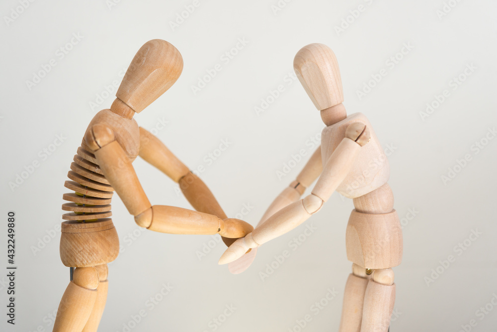 two artist's manikin (mannikin) acting and reacting on a mock stage two artist's manikin (mannikin) acting and reacting on a mock stage