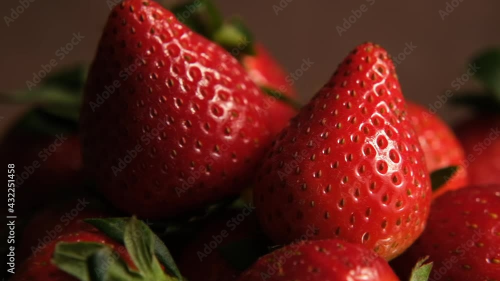 Strawberries macro. Close up of fresh ripe red strawberries rotating. Strawberries macro. Close up of fresh ripe red strawberries rotating.