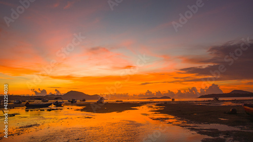 red sunrise over sea footage. Nature image High quality footage. Scene of Colorful romantic sky sunrise the sky background. beautiful sky at sunrise in nature and travel concept. © Narong Niemhom