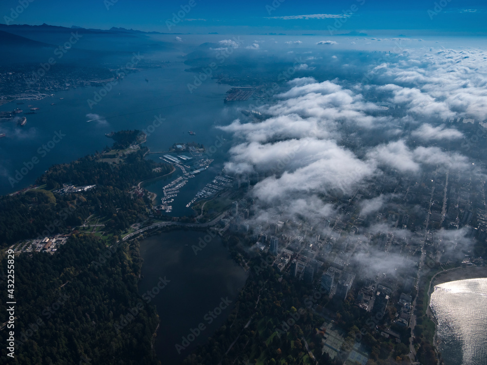 Stock aerial photo of scattered clouds over Stanley Park and downtown Vancouver, Canada