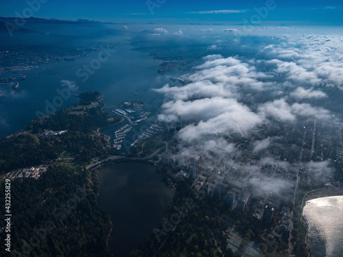 Stock aerial photo of scattered clouds over Stanley Park and downtown Vancouver, Canada