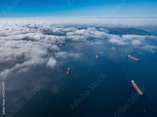 Stock aerial photo of scattered clouds over English Bay dotted with freighters, Canada
