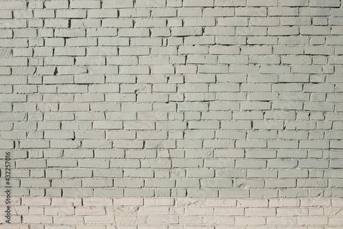 Background of wide white and cream brick wall texture. Old brown brick wall concrete or stone textured, wallpaper limestone abstract wall. Home or office design backdrop