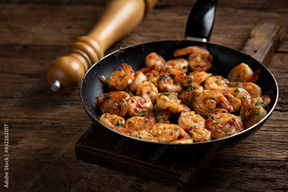 Delicious grilled prawns on wooden background. Delicious grilled prawns on wooden background.